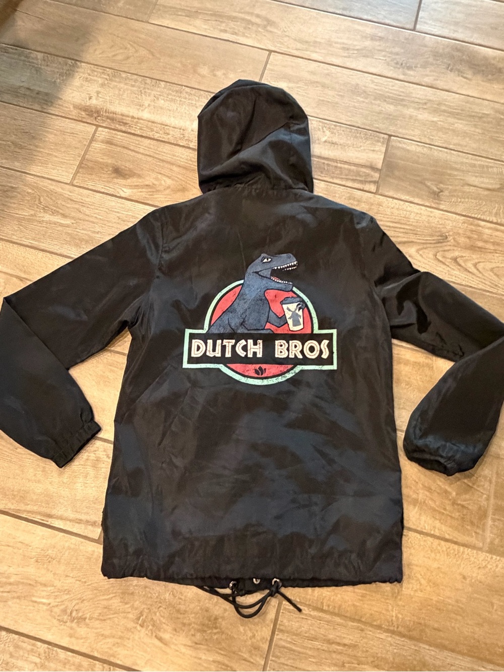 Dutch Bros Jurassic Park windbreaker features fun back graphic Size XS Like New